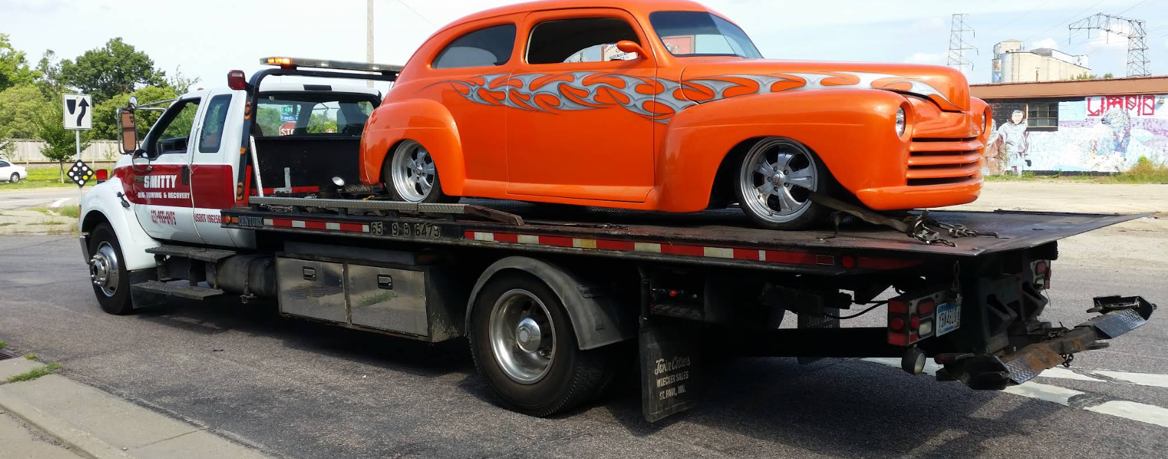 Custom orange hot rod on Smitty flatbed truck